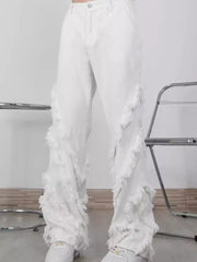 White wide-leg jeans for men with fringe trim detail.