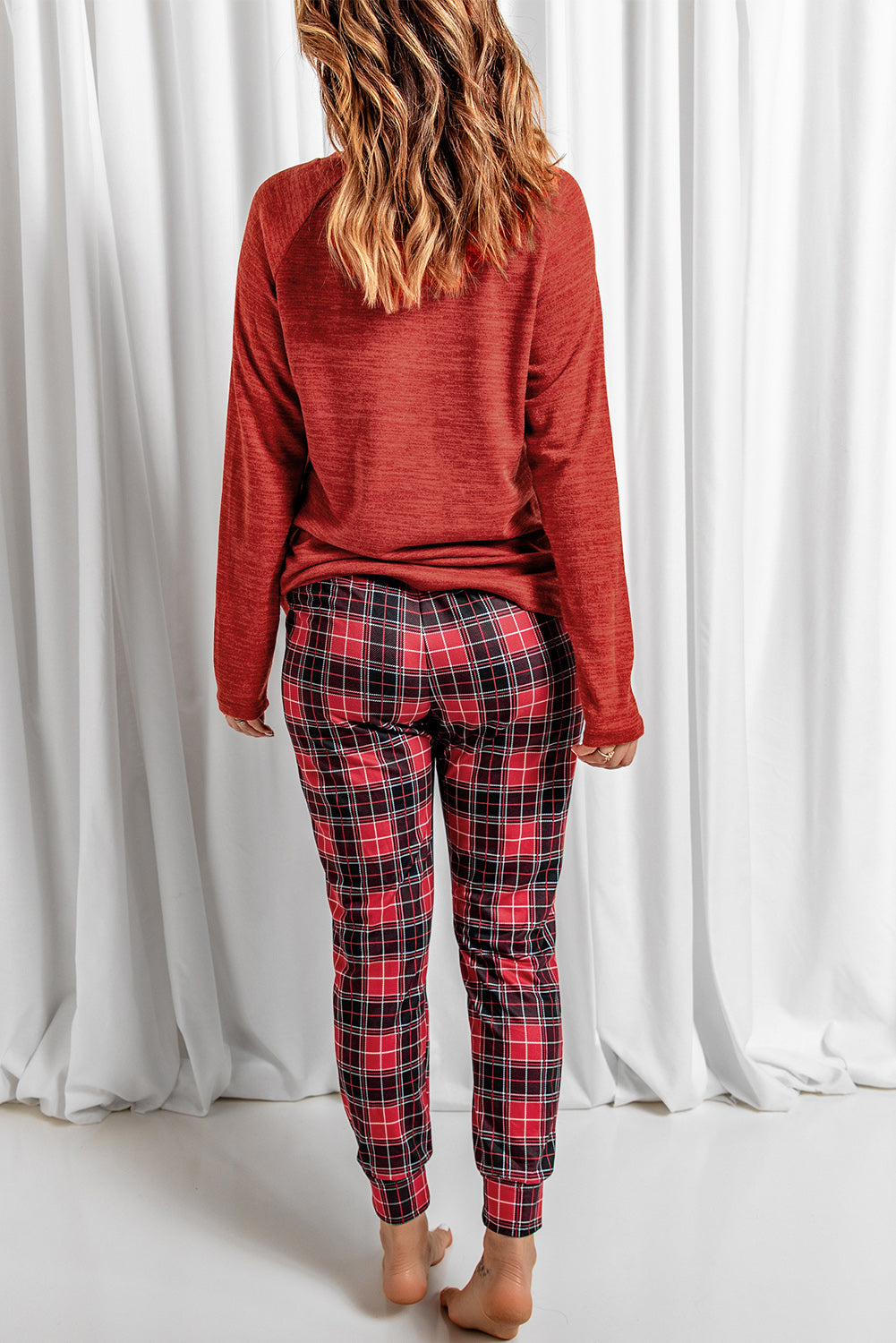 Cozy Plaid Jogger Lounge Set in Deep Red with red and black plaid pattern joggers and a long-sleeve top.