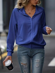 Royal blue ribbed zip-up track jacket with raglan sleeves and a stand-up collar.