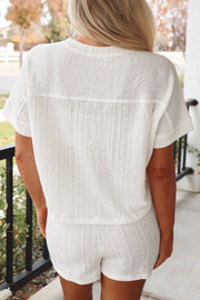 White textured knit drawstring short set with short sleeves and a relaxed fit.