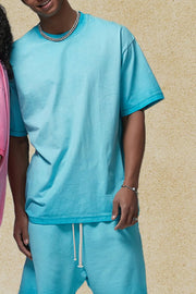 Pigment-dyed oversized tee in Pastel Blue with a crew neck and short sleeves.