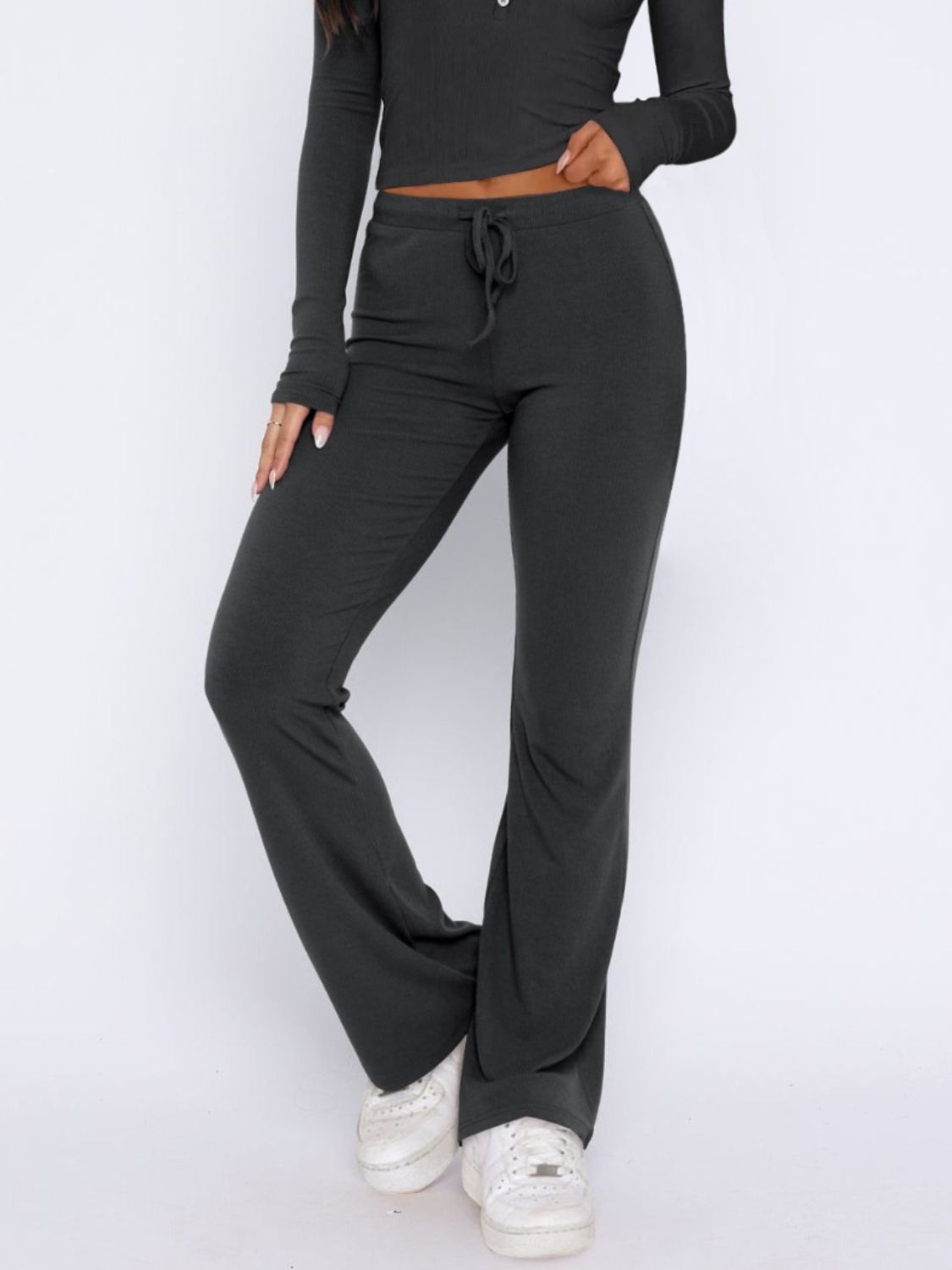 Dark gray loungewear pants with drawstring waist and flared leg
