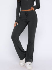 Dark gray loungewear pants with drawstring waist and flared leg