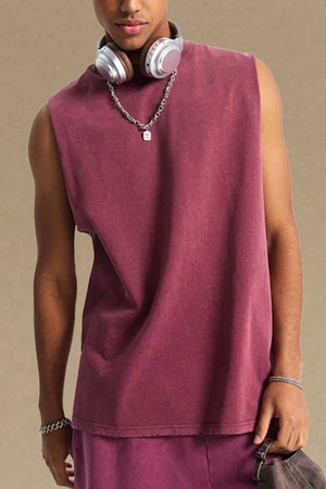 Washed cotton muscle tank in burgundy with a relaxed fit and raw hem.