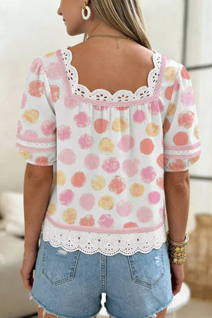 White polka dot blouse with puff sleeves, square neckline, and lace trim.