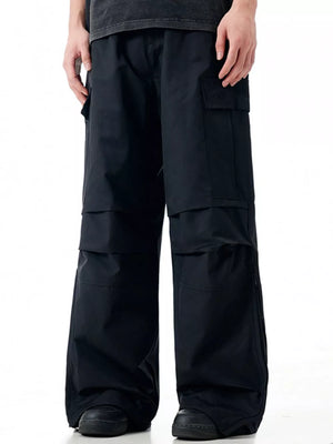 Black cargo sweatpants with multiple pockets and a relaxed fit.