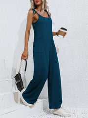 Deep Teal tie-strap wide leg jumpsuit with pockets, worn casually.