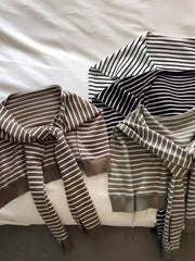 Tie-front breton stripe sweater in black and white, camel, and moss green acrylic.