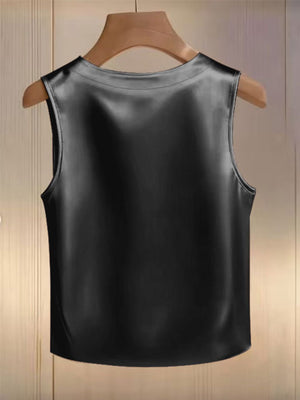 Black satin tank top with pearl embellishments, round neckline, sleeveless.