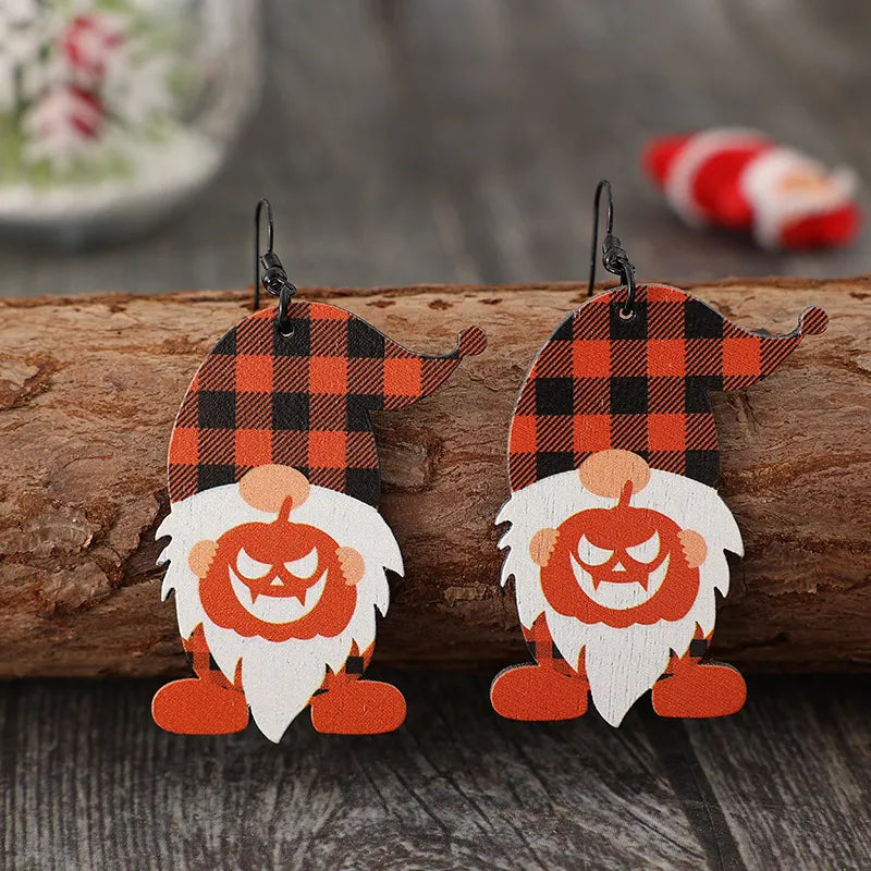 Gnome plaid pumpkin patch earrings with orange and black buffalo check hats and jack-o-lantern faces.