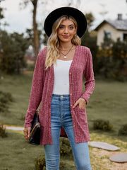 Longline ribbed knit button-down cardigan in dusty blue with pockets and wooden buttons.