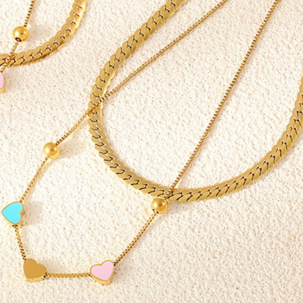 Gold double layered necklace with heart charms and beads