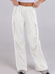 White cargo pocket drape wide leg sweatpants with elastic waistband.