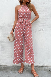 Pink polka dot halter neck palazzo jumpsuit with tie belt
