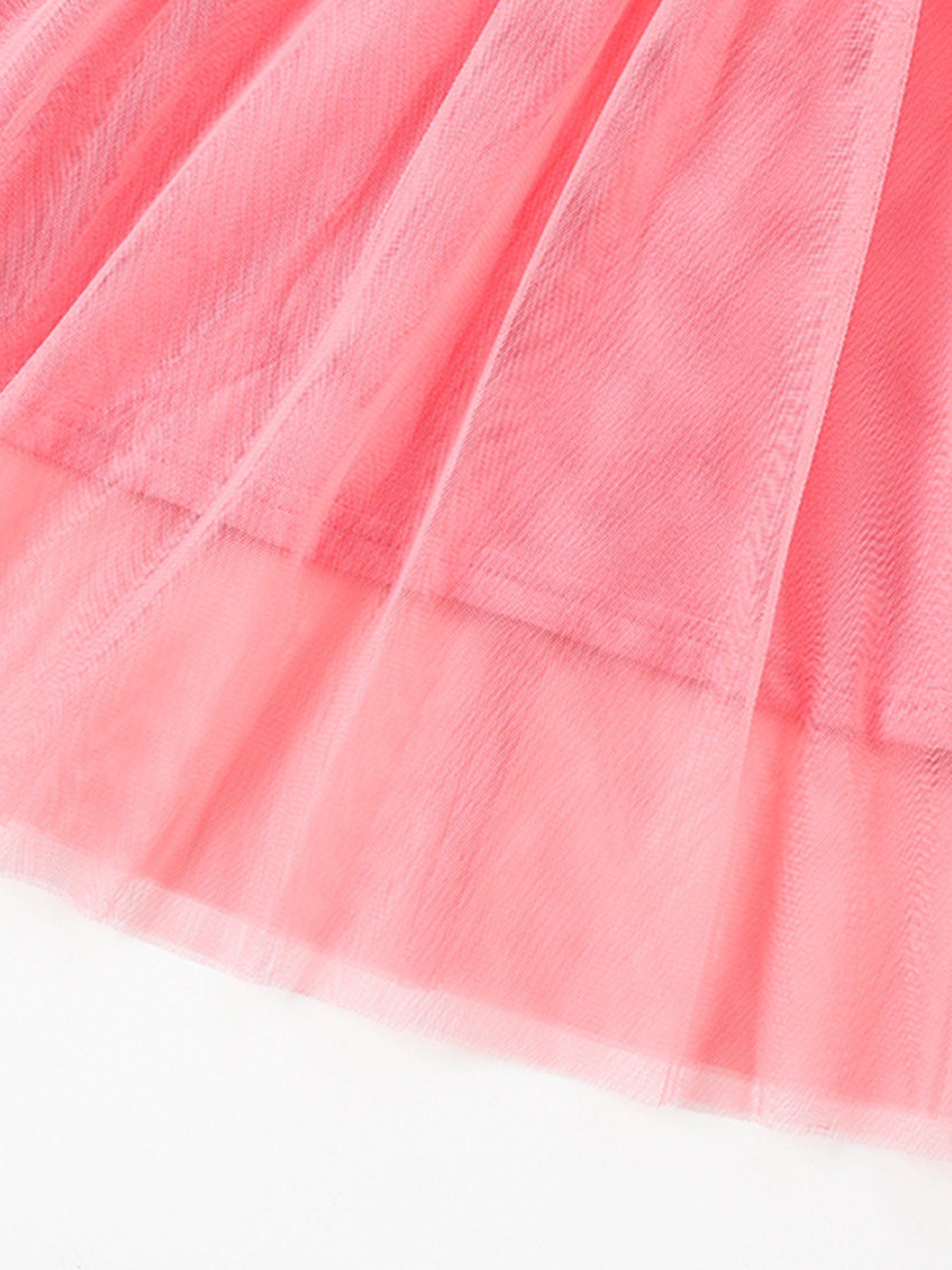 Pink toddler tulle dress with layered ruffles and subtle sequin flower detail.