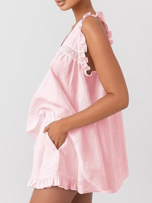 Blush pink ruffled V-neck top and shorts set with lace trim and pockets.