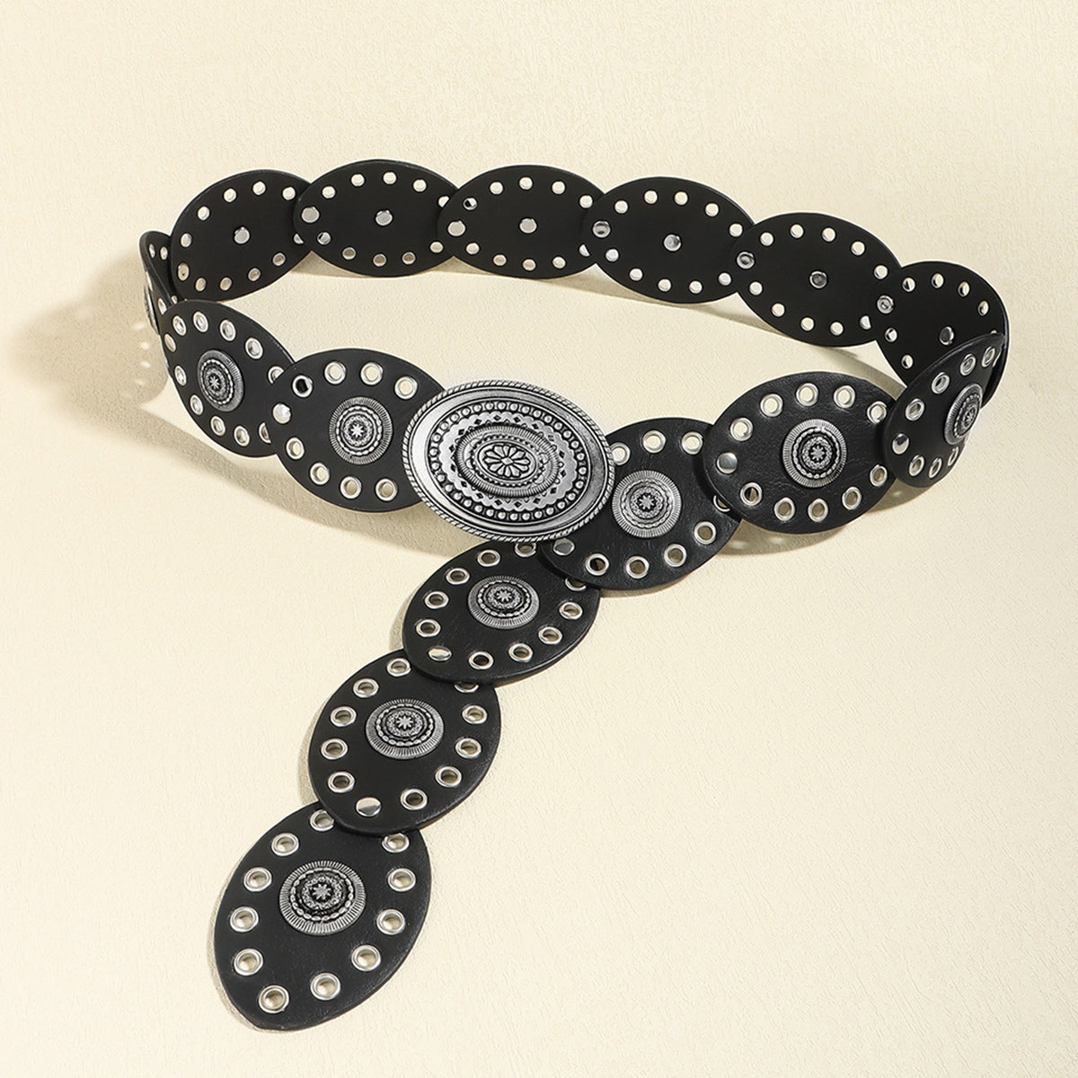 Black leather belt with oval eyelet details and antique silver oval buckle.