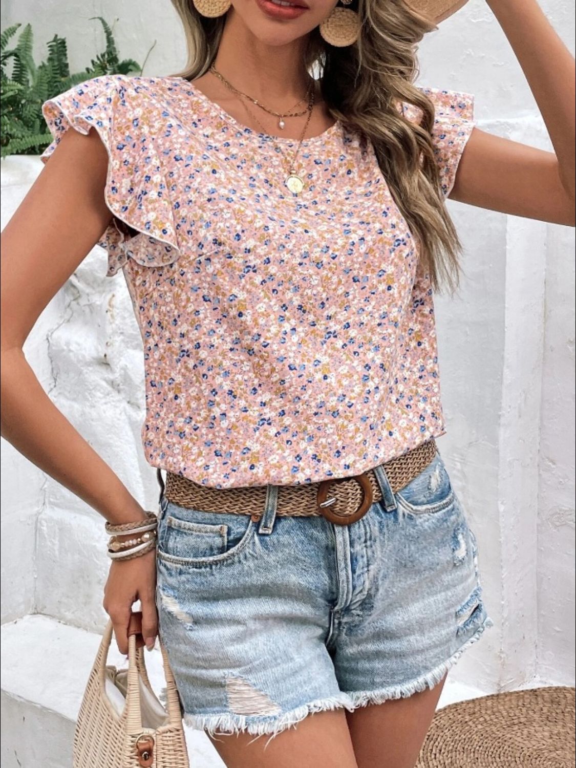 Floral flutter sleeve blouse in pale blush with a mixed floral print.