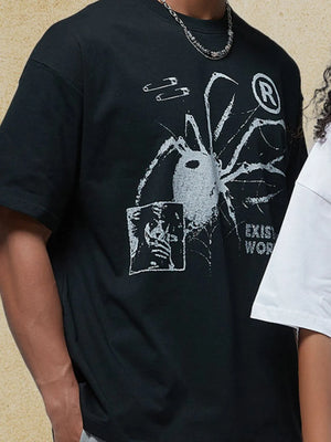 Black oversized graphic tee with spider, safety pins, and text print