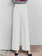 White high-waisted wide leg cotton trousers with pockets, elegant and comfortable.
