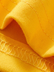 Yellow toddler tee and shorts set fabric detail with zigzag stitching.
