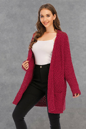 Burgundy textured cocoon cardigan with patch pockets and open front.
