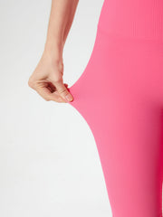 Ribbed contour cycling shorts in strawberry pink, showing stretch fabric.