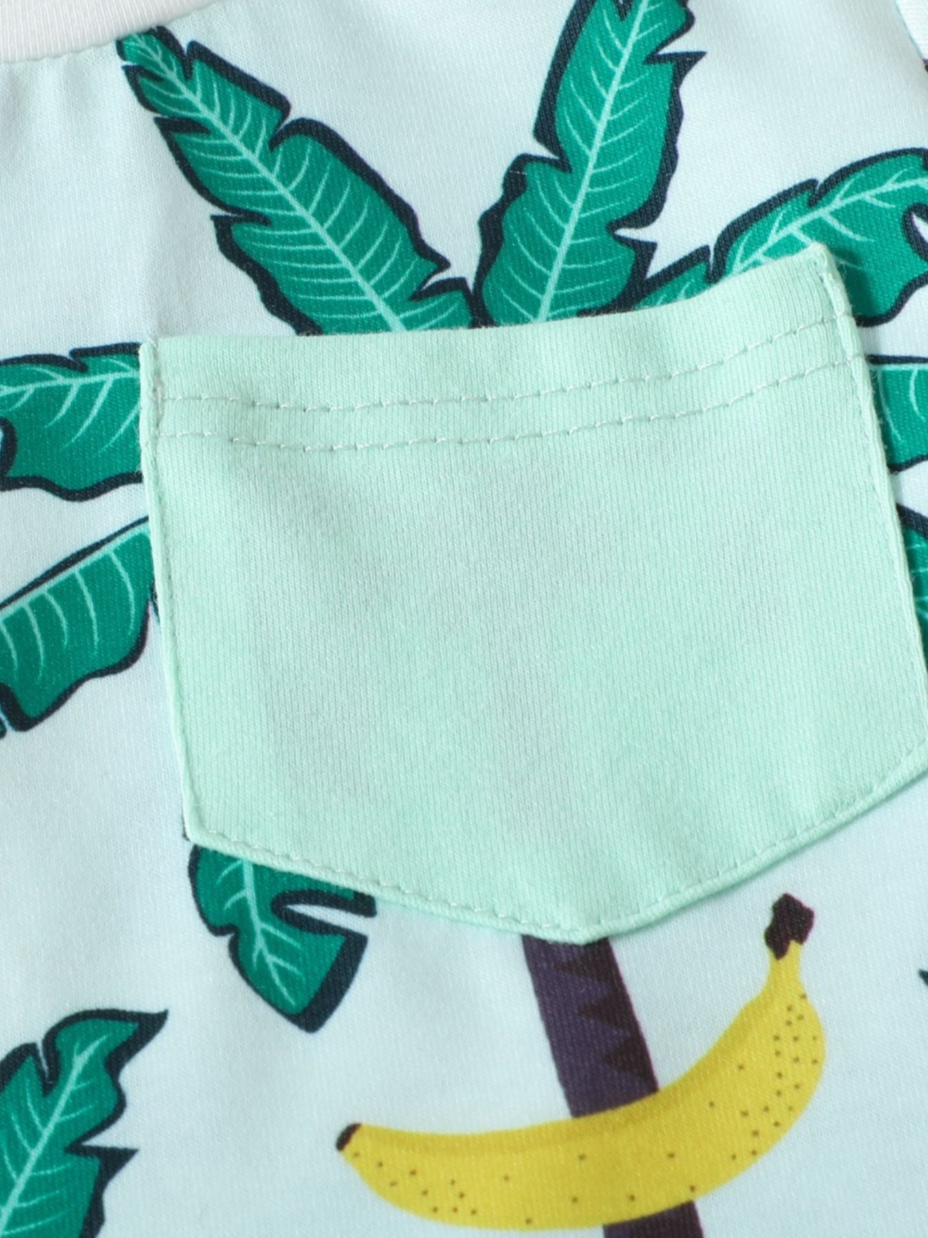 Baby set in French Blue with tropical banana and palm leaf print, featuring a light green pocket.