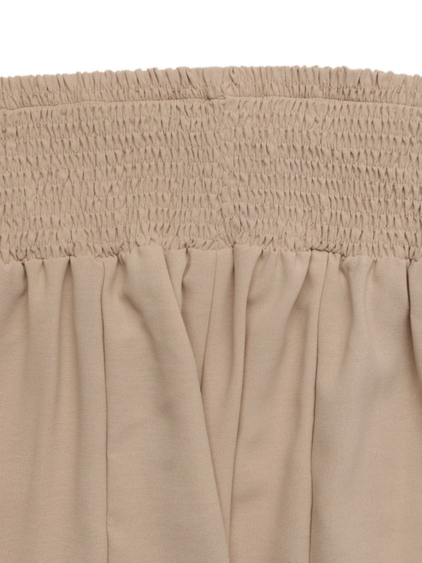 Smocked waist wide leg trousers in beige cotton with a relaxed fit.