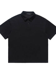 Black cotton blend polo shirt with buttoned placket and short sleeves.