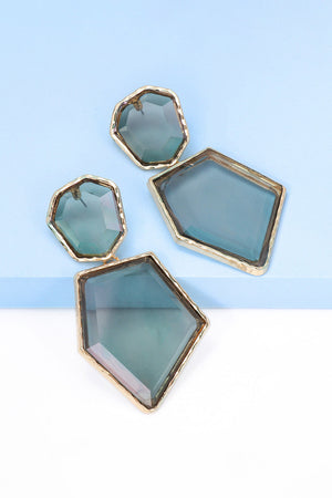 Resin facet drop earrings with gold trim in light blue and gray tones.