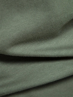 Moss green cotton polo shirt fabric detail