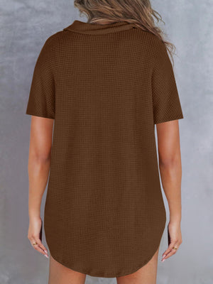 Brown waffle knit polo shirt with button detail and short sleeves.