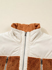 Cozy color block vest coat with cream and brown sherpa panels and a zippered front.