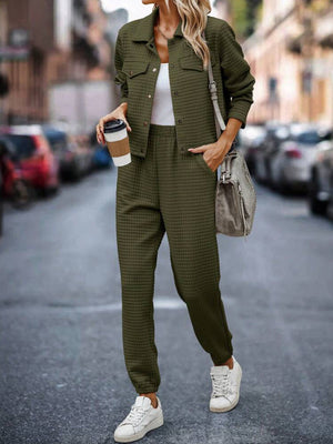 Army green quilted co-ord jacket and joggers set with a white tank top and sneakers.