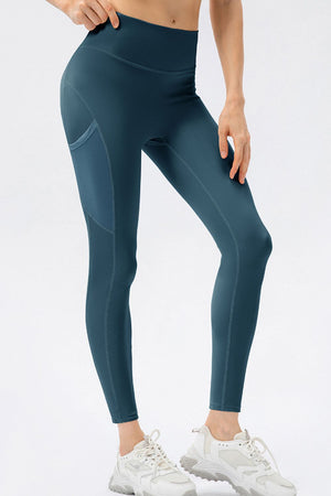 Deep Teal mesh pocket performance leggings with contrast stitching