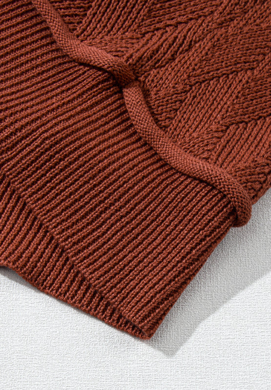Textured diamond knit acrylic sweater in rust with ribbed details and a rope trim.