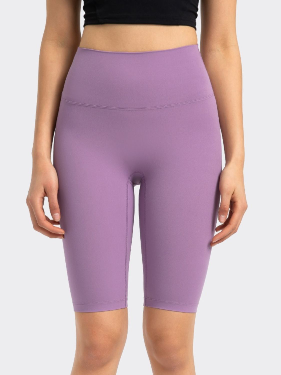 Lavender activewear shorts with a high waist and seamless design.