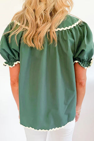 Moss green blouse with puff sleeves and scalloped trim detail.