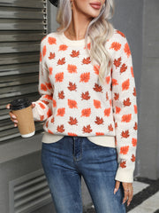 White acrylic knit crewneck sweater with allover orange and brown leaf print.