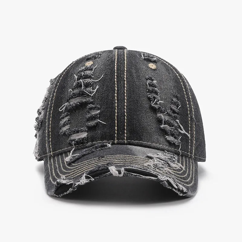 Dark ripped denim baseball cap with distressed details and contrast stitching.