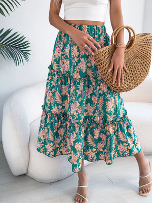 Green floral midi skirt with ruffle hem detail and tiered design.