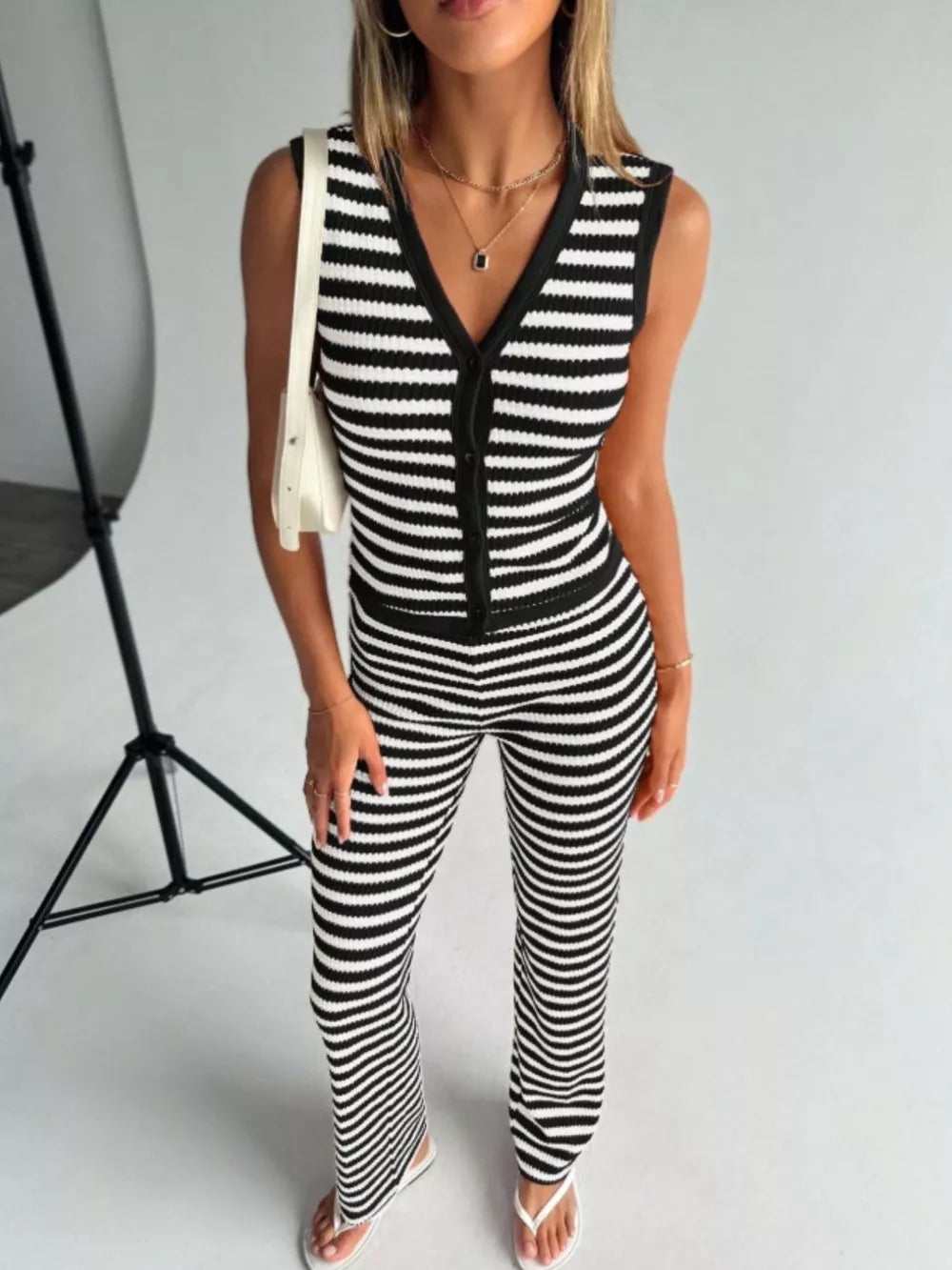 Black and white striped knit V-neck button-front sleeveless top and flare pants set