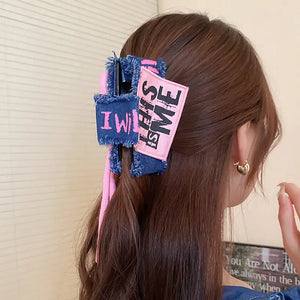 Denim patchwork claw clip with drawcord and "This is Me" text detail.