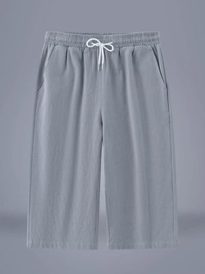 Light gray relaxed fit cropped sweatpants with drawstring waist and pockets