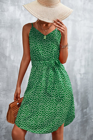 Green daisy print slip dress with tie waist and V-neck