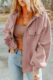 Textured utility hoodie jacket in blush pink with zip front, drawstring hood, and chest pockets.