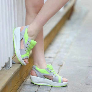Sporty lace-up wedge sandals in lime green and gray with open toe and adjustable laces.
