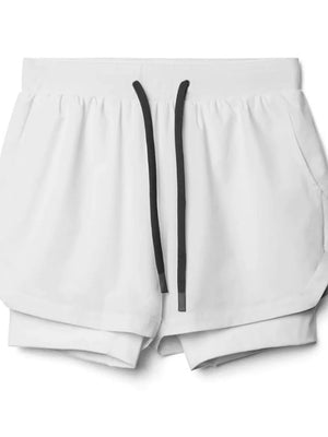 White layered performance shorts with perforated panels and a drawstring waist.