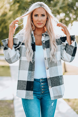 Oversized checkered shacket in light gray and black with button-down front and patch pocket.